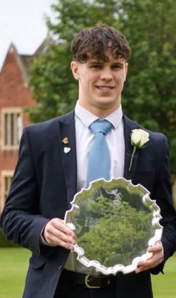 George Hastings holding the Cooke's Prize salver at Bromsgrove School
